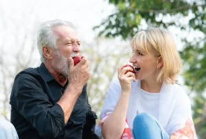 Patient with all-on-4 biting apple